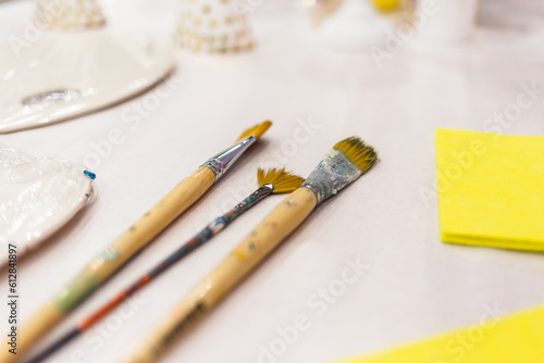 Paintbrushes are lying on the table