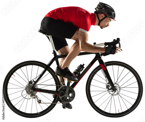 Fototapeta Naklejka Na Ścianę i Meble -  Isolated young professional male bike rider, cyclist on road bike over transparent background. Profile view.