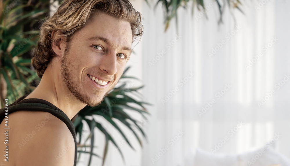 Smiling young man relaxed in home Smiling young man relaxed in home
