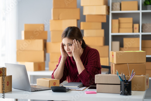 Photography Woman seller SME retail owner feeling upset and disappointed about her recent sell record