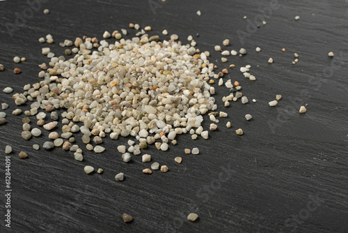 Crushed Quartz Pile, White Stone Pieces, Grit Sand, Decorative Rocks Texture on Black Background