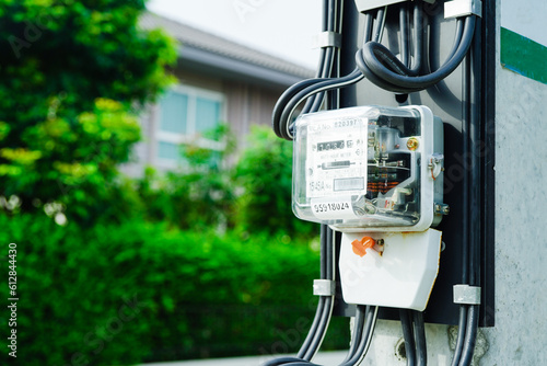 Electric measuring power meter for energy cost at home and office, solar cell concept.