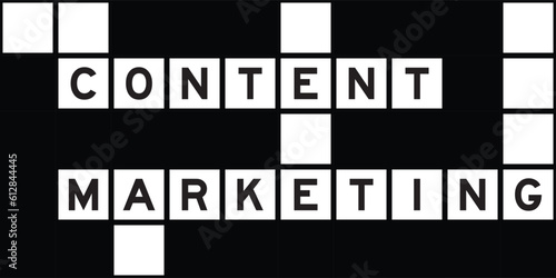 Alphabet letter in word content marketing on crossword puzzle background