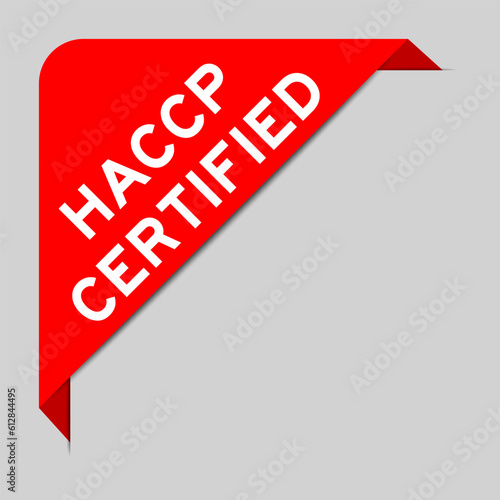 Red color of corner label banner with word HACCP (Hazard Analysis Critical Control Points) certified on gray background