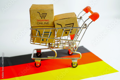 Online shopping, Shopping cart box on Germany flag, import export, finance commerce.