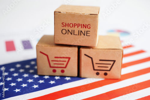 Online shopping, Shopping cart box on USA America flag, import export, finance commerce.