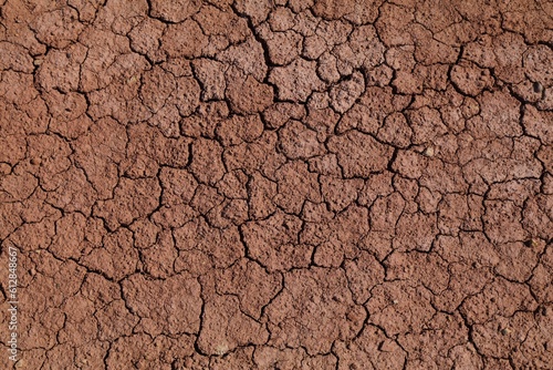 Dried mud surface - dry riverbed earth texture. Drought in Morocco. photo