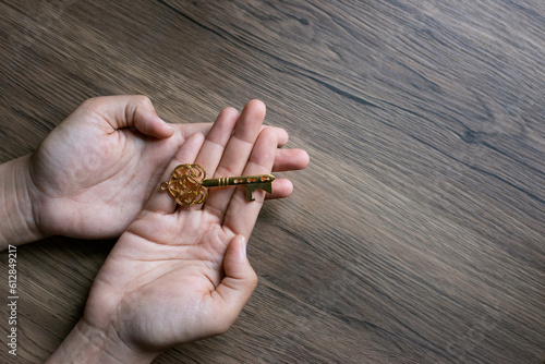 Woman hand with a key nutural light. photo