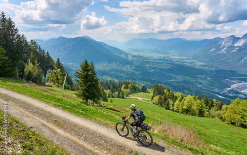 active senior woman on a mountain bike tour in the carinthian alps above Villach in Austria © Uwe