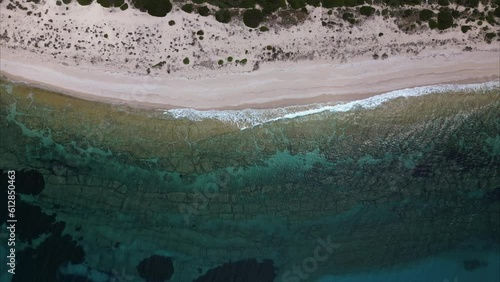 Aerial view of waves on beaches off Lefkada Greece with crystal clear blue water