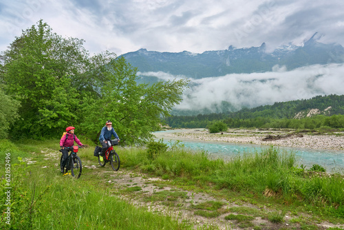 Fotografie active senior couple  on a e-bike tour in the Valley of River Soca, Triglav Nati