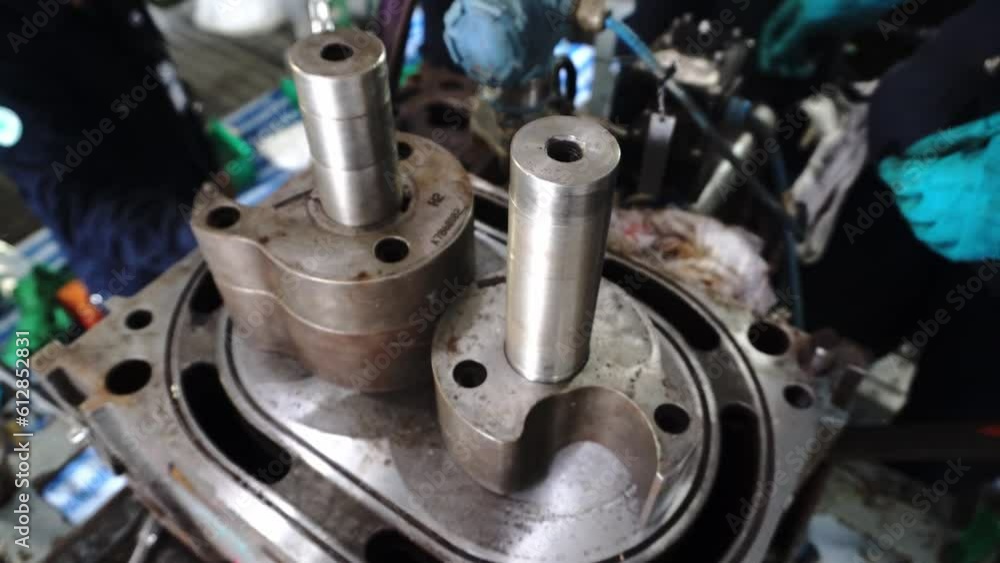 Experience the world of industrial technology. engineers repairing machines, ensuring availability. Embrace precision and innovation in manufacturing. Ideal for projects showcasing craftsmanship