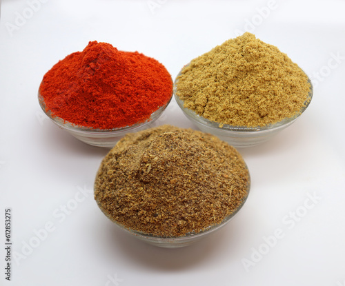 Close up of three basic, main and essential ingredients or spices of Indian/Asian food. Coriander powder, Garam masala and the spicy Red chili powder.