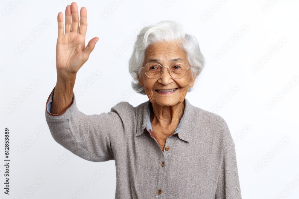 Close-up portrait photography of a beautiful old woman waving with the hand against a white background. With generative AI technology Close-up portrait photography of a beautiful old woman waving with the hand against a white background. With generative AI technology