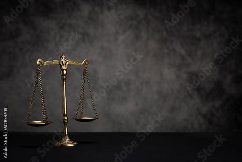 scales of justice on black background
