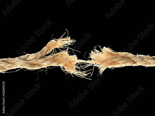 Stressed rope on black background photo