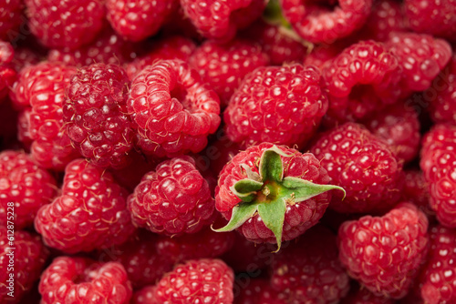 delicious fresh raw red raspberries close-up. harvest. healthy food. diet. summer. vitamins. soft focus. background