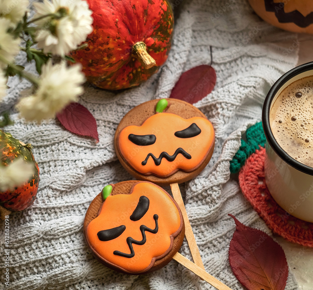 Fresh Halloween gingerbread cookies with cup of hot coffee on a light background. Top view. Fresh Halloween gingerbread cookies with cup of hot coffee on a light background. Top view.