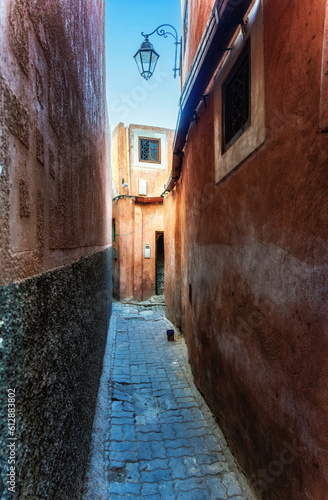 A small orange traditional alley in Marrakech, Morocco © atosan