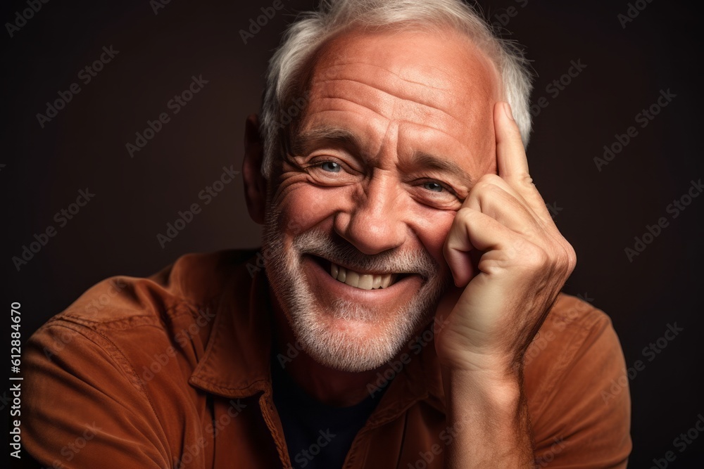 Close-up portrait photography of a happy mature man putting the hand on the chin as if thinking against a copper brown background. With generative AI technology Close-up portrait photography of a happy mature man putting the hand on the chin as if thinking against a copper brown background. With generative AI technology