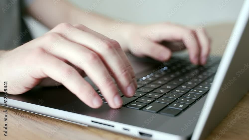 Hands person typing on laptop keyboard close up. Programmer, coder, IT worker writes code, coding Mаn fingers at workplace in office or home at table. Writes a text message, works online. Freelancer Hands person typing on laptop keyboard close up. Programmer, coder, IT worker writes code, coding Mаn fingers at workplace in office or home at table. Writes a text message, works online. Freelancer