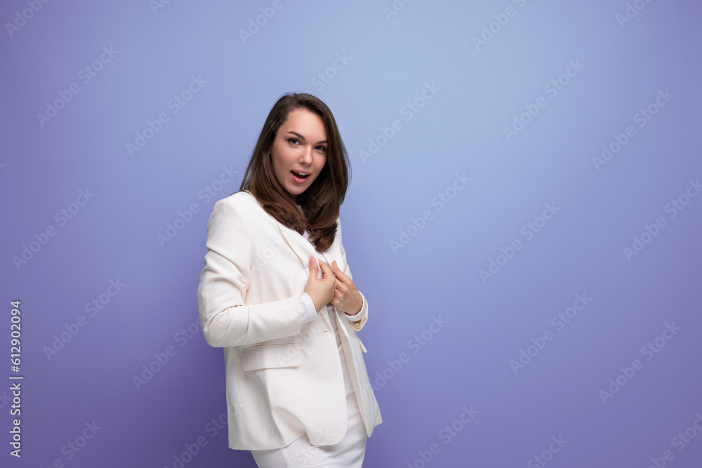 brunette business woman in dress is successful in model posing brunette business woman in dress is successful in model posing