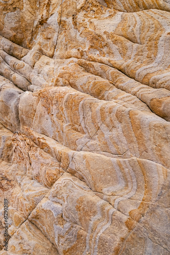 Rock texture in yellow and gray tones.