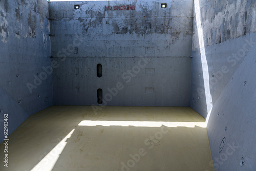 Empty hold on dry cargo vessel. Cargo hold on coaster ship. Commercial shipping. Cargo delivery. photo