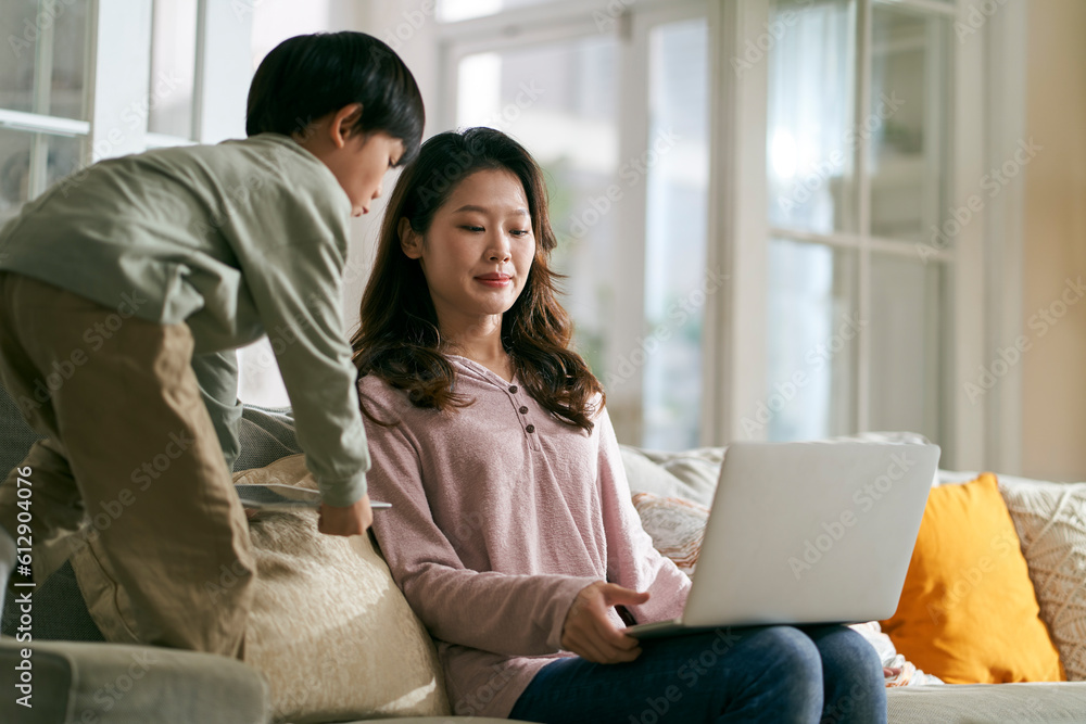 working asian mother annoyed by hyperactive child working asian mother annoyed by hyperactive child