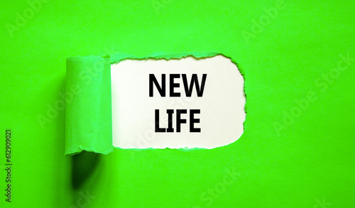 New life symbol. Concept words New life on beautiful white paper on a beautiful green background. Business, support, motivation, psychological and new life concept. Copy space.
