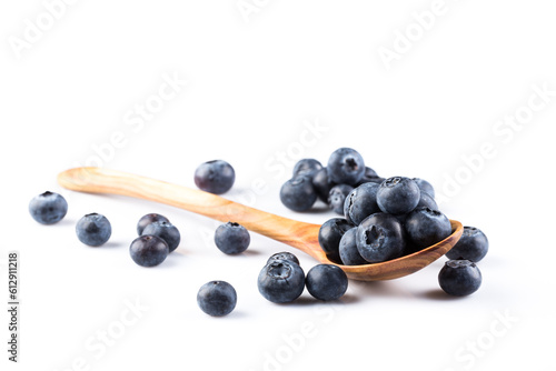 Fresh blueberries in wooden spoon