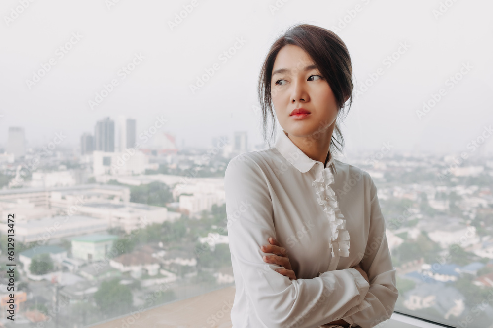 Business asian woman inteupreneur standing by the windows with city veiw. Business asian woman inteupreneur standing by the windows with city veiw.
