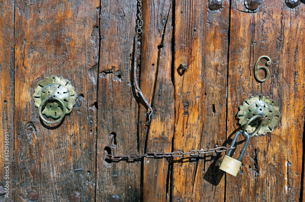 Wooden door of an old stone house in the traditional village of Vitsa in Zagori, Greece Wooden door of an old stone house in the traditional village of Vitsa in Zagori, Greece