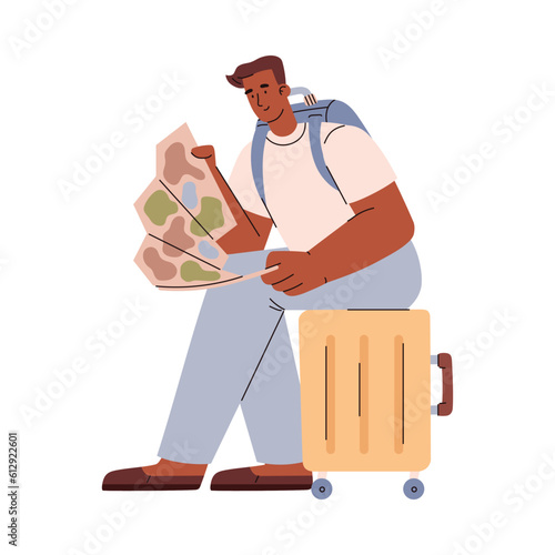Smiling tourist man sitting on suitcase and watching on map flat style