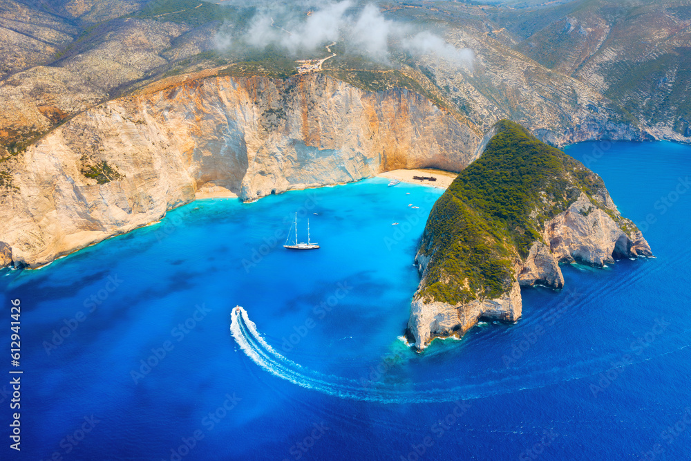 Obraz na płótnie View of Navagio beach, Zakynthos Island, Greece. Aerial landscape. Azure sea water. Top view from a drone. Summer time for sea travel. The sea bay. Photo for background and wallpaper. w salonie