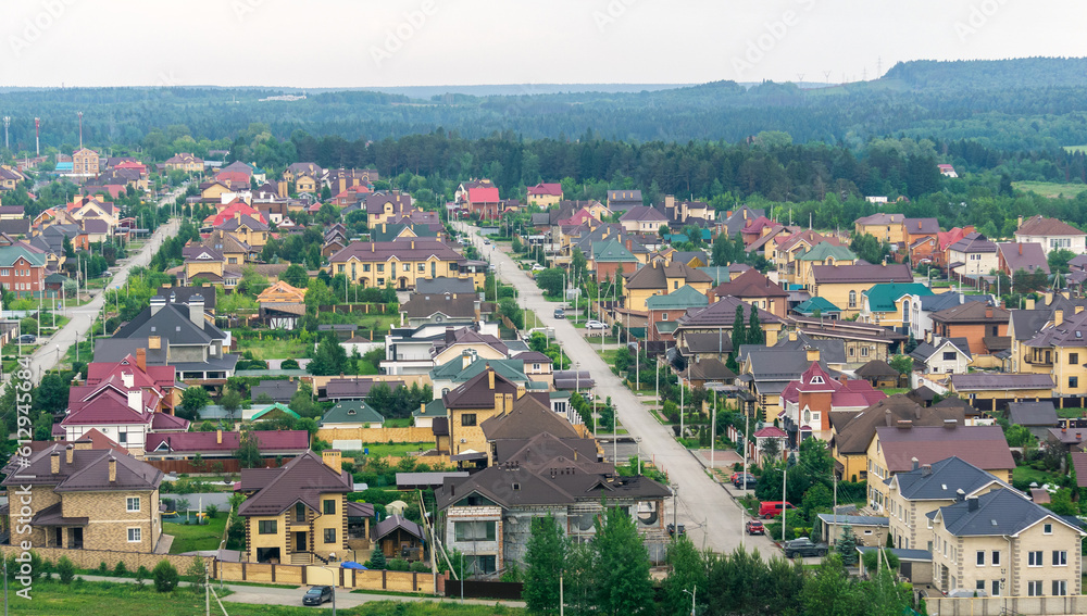 suburban area with residential buildings in a wooded area, top view