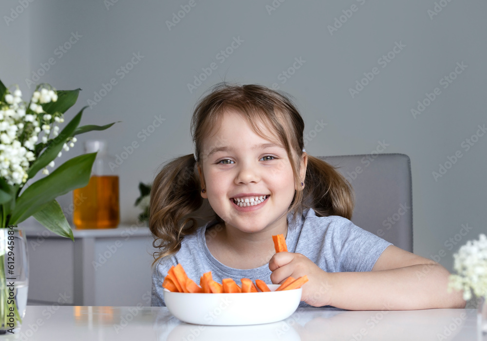 Little child eating carrots empty space background. Healthy nutrition