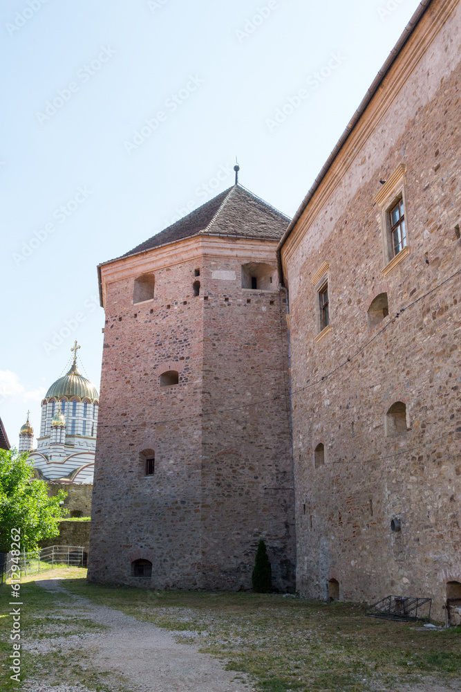 Protective walls of the incredible historical Fagaras Fortress on a sunny day. Transylvania. Romania