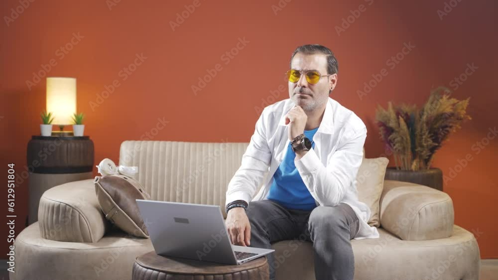 Man looking at laptop is thoughtful. Man looking at laptop is thoughtful.