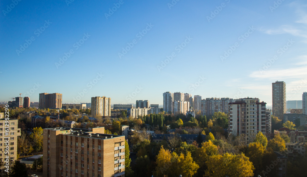 Panoramic cityscape - top view - modern high-rise buildings and autumn trees on a clear sunny day in Reutov, Moscow region Panoramic cityscape - top view - modern high-rise buildings and autumn trees on a clear sunny day in Reutov, Moscow region