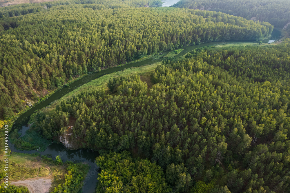 meandering river view from drone, summer time in the evening