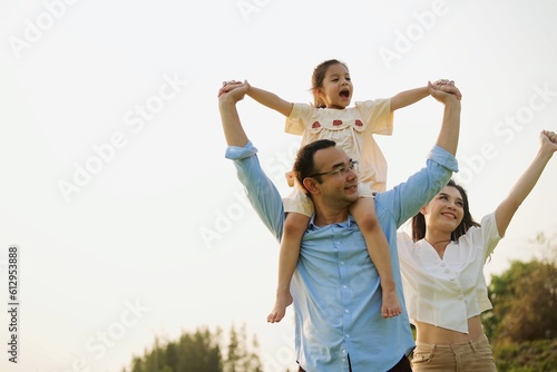 Portrait of happy family travel in park on weekend with sunset view, Father mother and children having activities outdoor playing together with happiness, Family lifestyle 