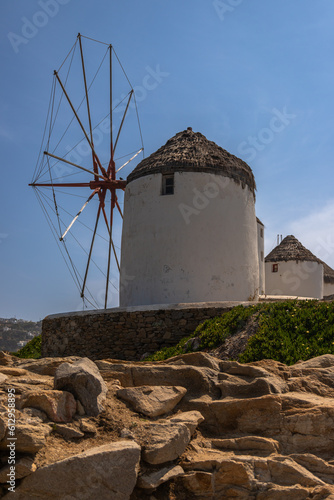 Exposure of Myknos famous Windmills, on a sunshiny day showing the pretty views of this magnificent island. photo