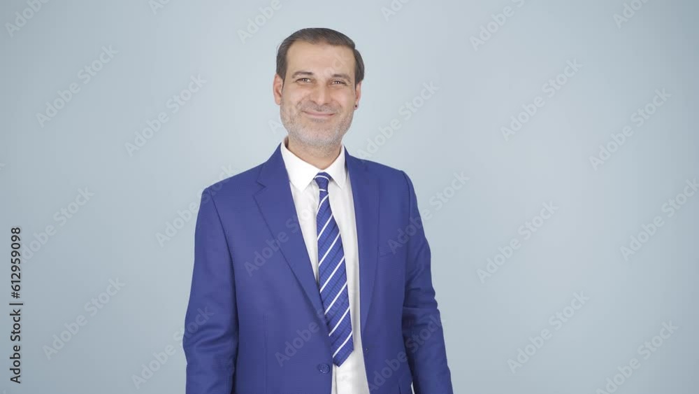 Businessman nodding to the camera. Approval. Businessman nodding to the camera. Approval.