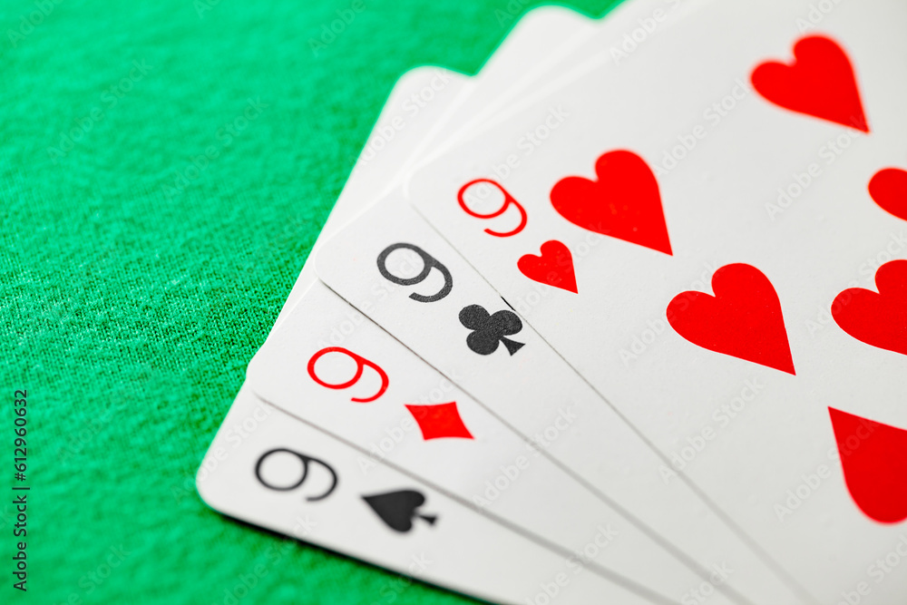 Poker combination four of kind, quads, of four nines cards of different suits, selective focus Poker combination four of kind, quads, of four nines cards of different suits, selective focus