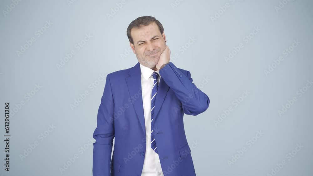 Businessman suffering from toothache. Businessman suffering from toothache.