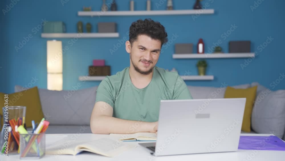 Male student looking at camera with positive and positive gesture. Male student looking at camera with positive and positive gesture.