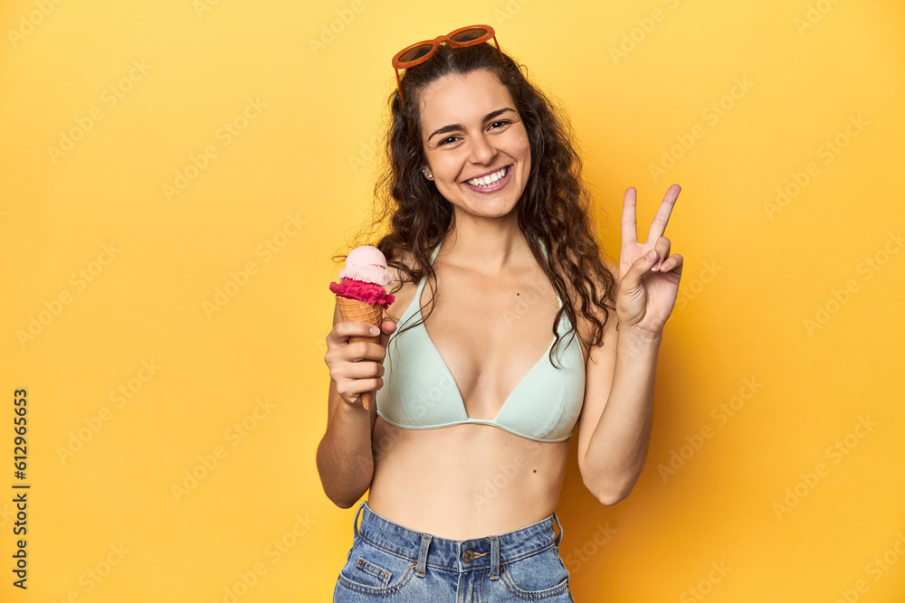 Fun summer vibes, woman with ice cream, vibrant yellow setting. Fun summer vibes, woman with ice cream, vibrant yellow setting.