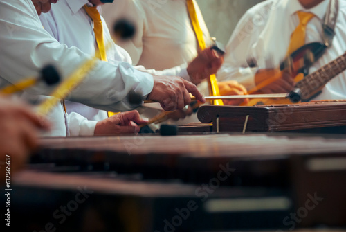 Marimba keyboard made of Hormigo wood, the national instrument of Guatemala, melodies and traditional sound in todaca for men at a party or celebration. photo