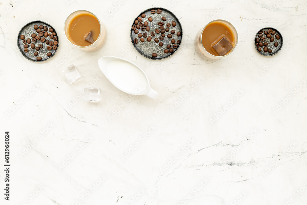 Top view of cold latte coffee with ice and coffee beans Top view of cold latte coffee with ice and coffee beans